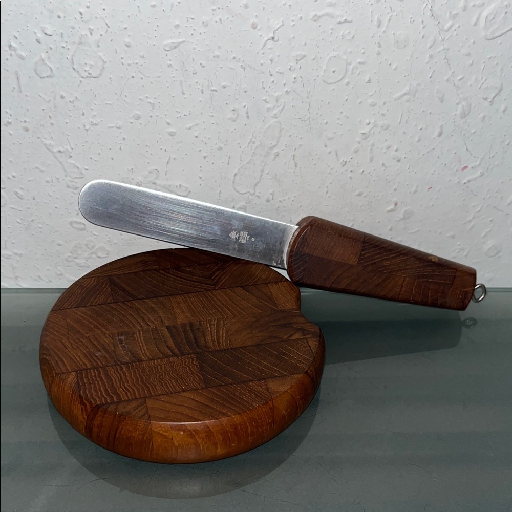 vintage Dansk teak cheese board with a built-in knife.